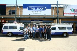 An image of the Trellidor staff in front of a Trellidor branch.