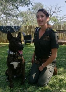 An image of a guard dog with its owner.
