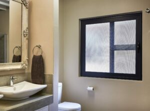 An image of Trellidor Clear Guard securing a bathroom window.