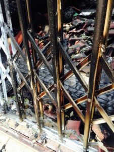 An image of a burnt security gate.