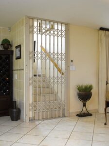 An image of a Retractable Security Gate securing a stairway.