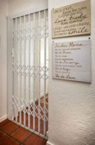 An image of a Retractable Security Gate securing a passage entrance.