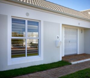 An image of a house secured with a Retractable Security Gate.