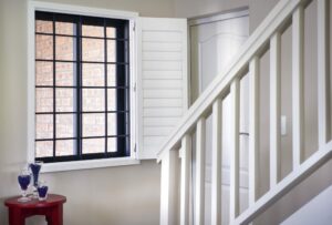 In image of a staircase and a window in a house.